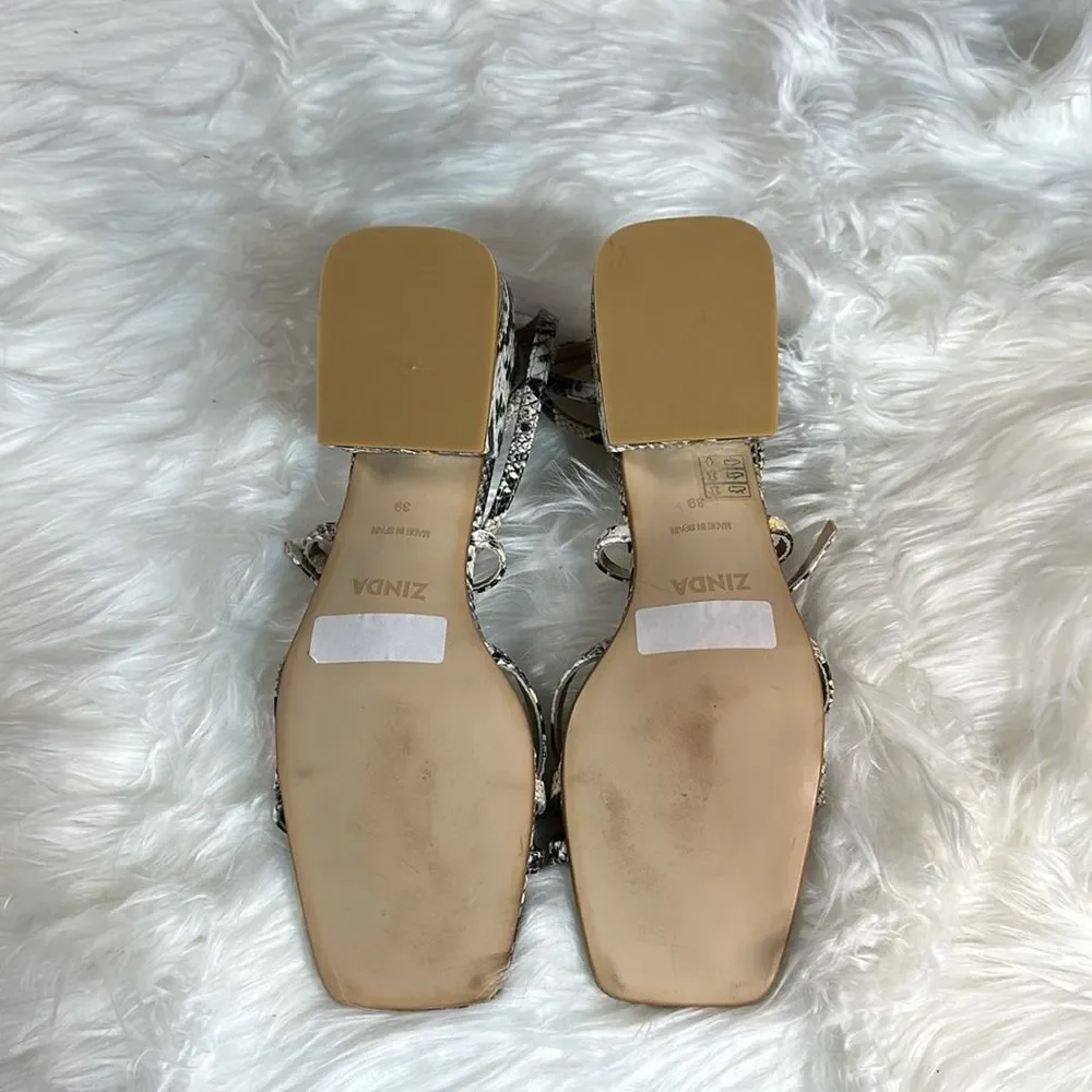 Unworn snake print wedges